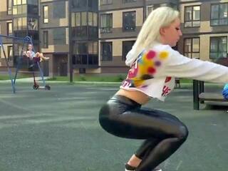 Blonde street girl is showing her leather leggings ass in public!
